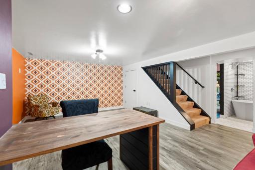 Open lower level layout with staircase to the main level