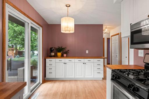 Dining area with built in cabinetry and backyard views