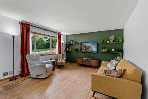 Spacious main level living room filled with natural light