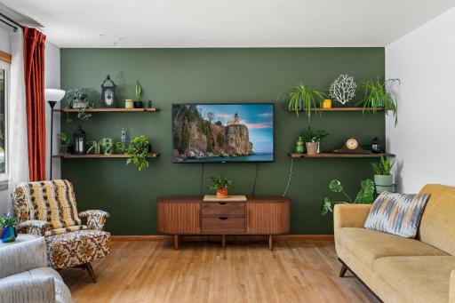 Accent wall and built in shelving add personality to the living room