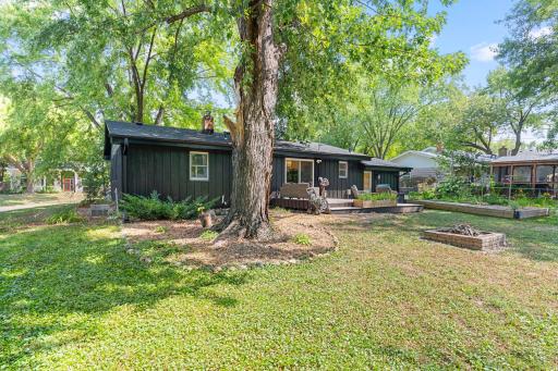 Spacious backyard with mature shade trees