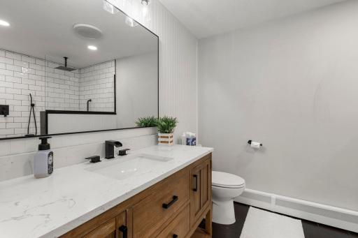 Updated 3/4 bathroom is perfect for rinsing off after the pool