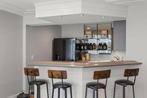 Host with ease at the full bar, a great spot for entertaining and socializing