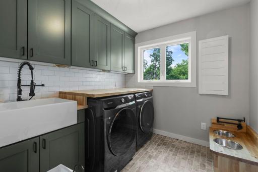 Main level laundry room with impeccable style