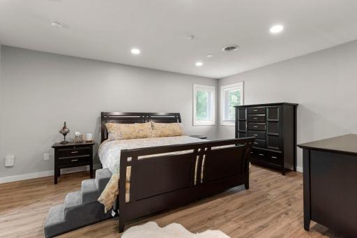 Upper level bedroom offers an ensuite bath and walk-in closet with a window and could be used as the primary bedroom