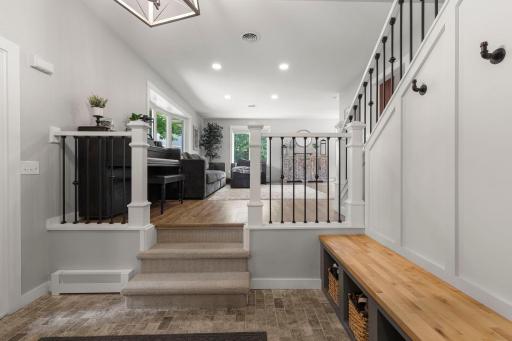 The open foyer provides a welcoming entry with a dedicated space for coats, shoes, and everyday storage