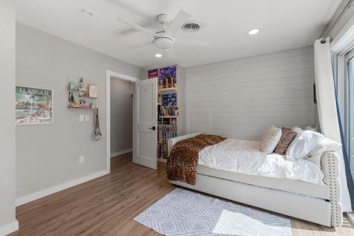 Upper level bedroom 2 could also be used as a primary bedroom and offers a ensuite bath, walk-in closet and private balcony