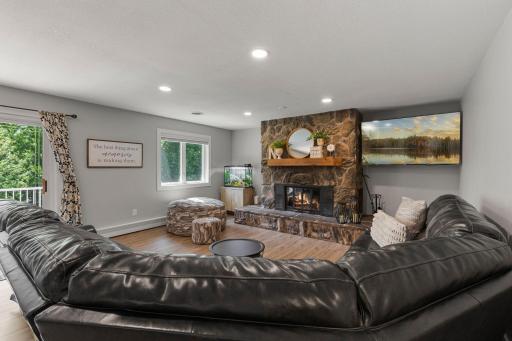 Family room is centred around a grand stone fireplace