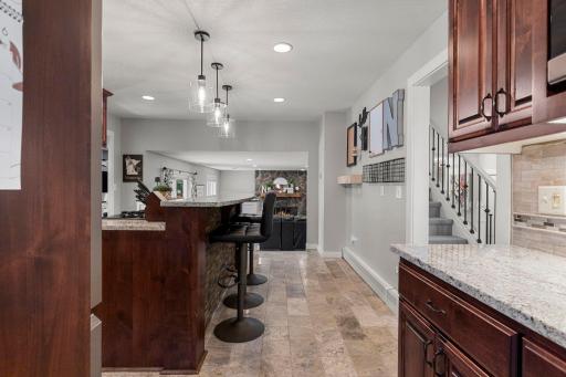 The kitchen is conveniently located off the dining room and offers a well-appointed space with modern updates and great functionality
