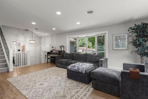 Beautiful light wood floors, updated fixtures, and modern hardware add warmth and style