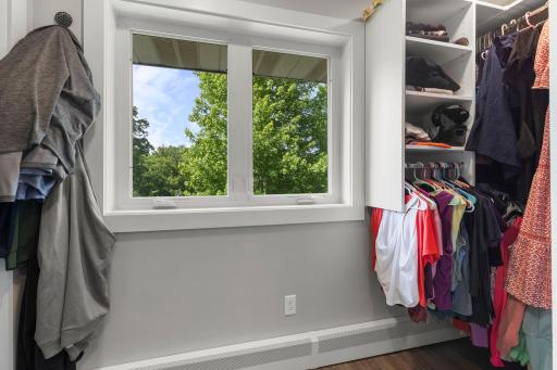 Walk-in closet with windows offers great natural light