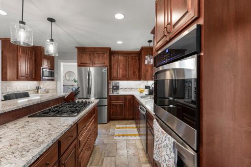 Kitchen includes a gas range and wall oven
