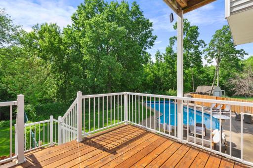 The deck offers a great place to grill and relax while overlooking the pool and backyard