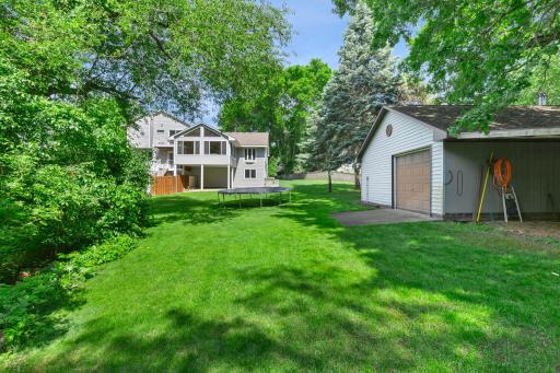 Enjoy added storage and functionality with a large backyard detached garage/storage shed, ideal for lawn equipment, tools, and seasonal items