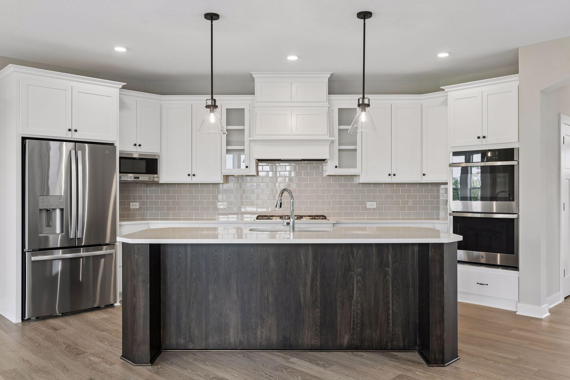 Our gourmet kitchen defines how the WOW comes standard. With a huge center island, granite countertops, gas cook top, and double ovens, plus so much more!
