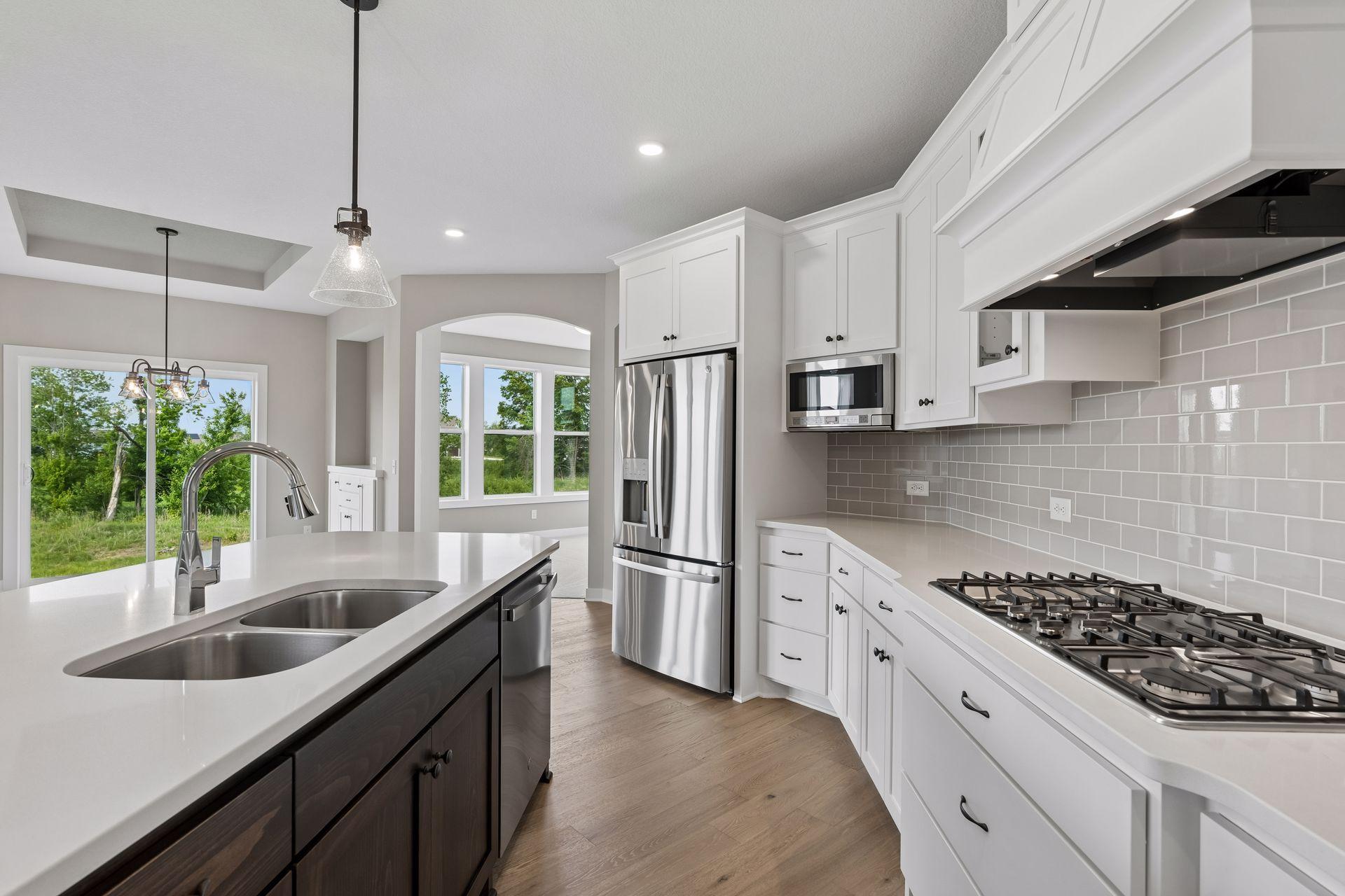 All our features are standard including the granite countertops, tile backsplash and under mount kitchen sinks.