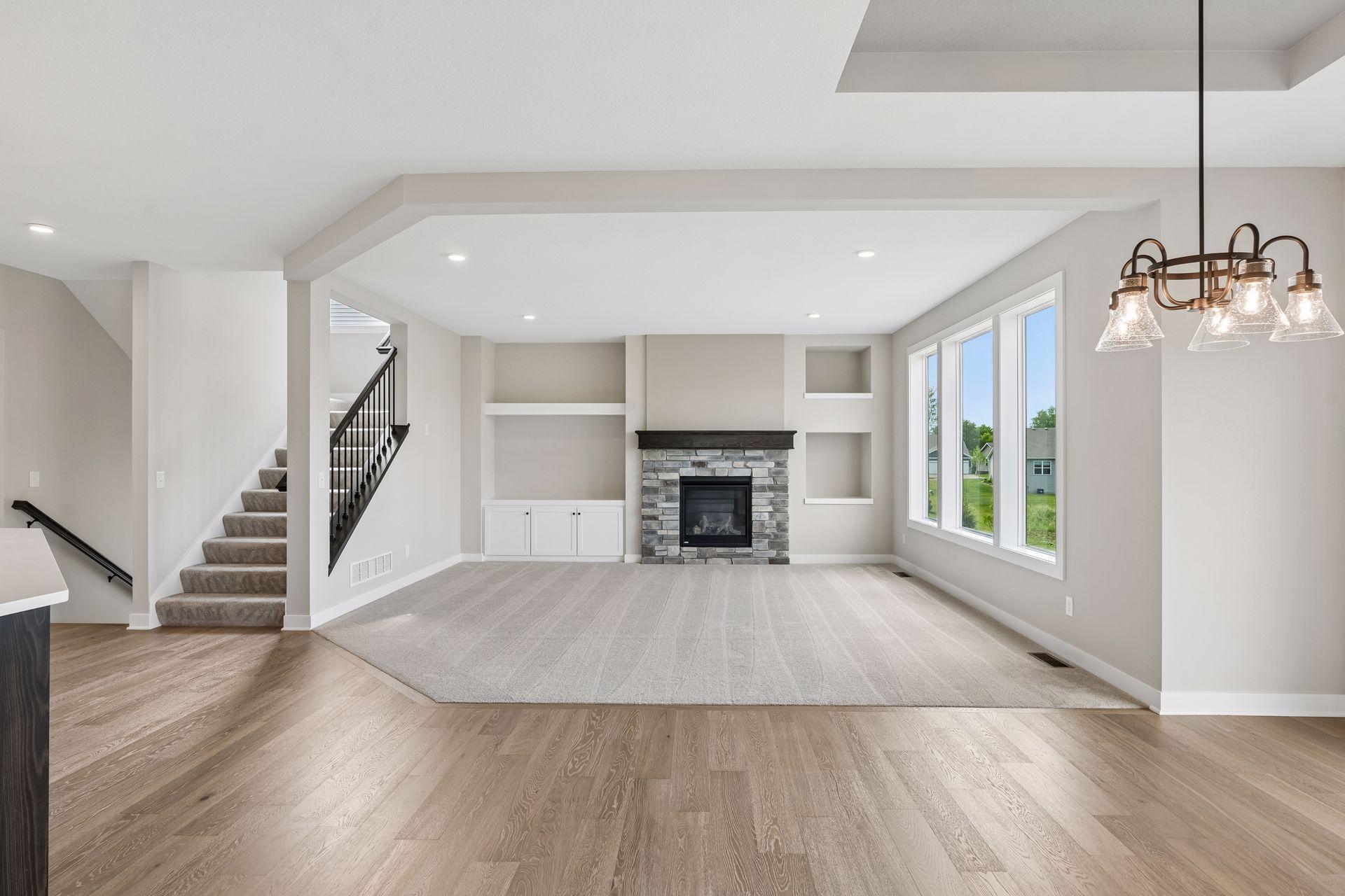 The living room on the main floor has a beautiful gas fireplace and wall built-ins.