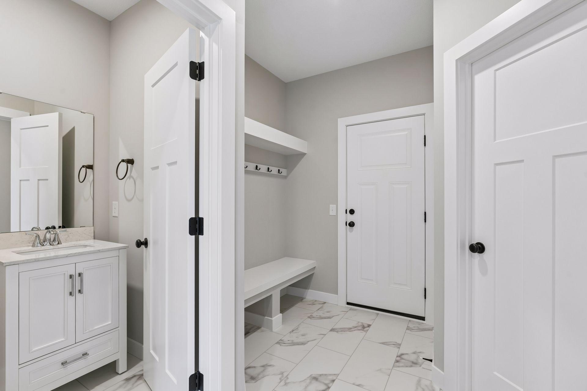 The spacious mud room helps your home stay organized.