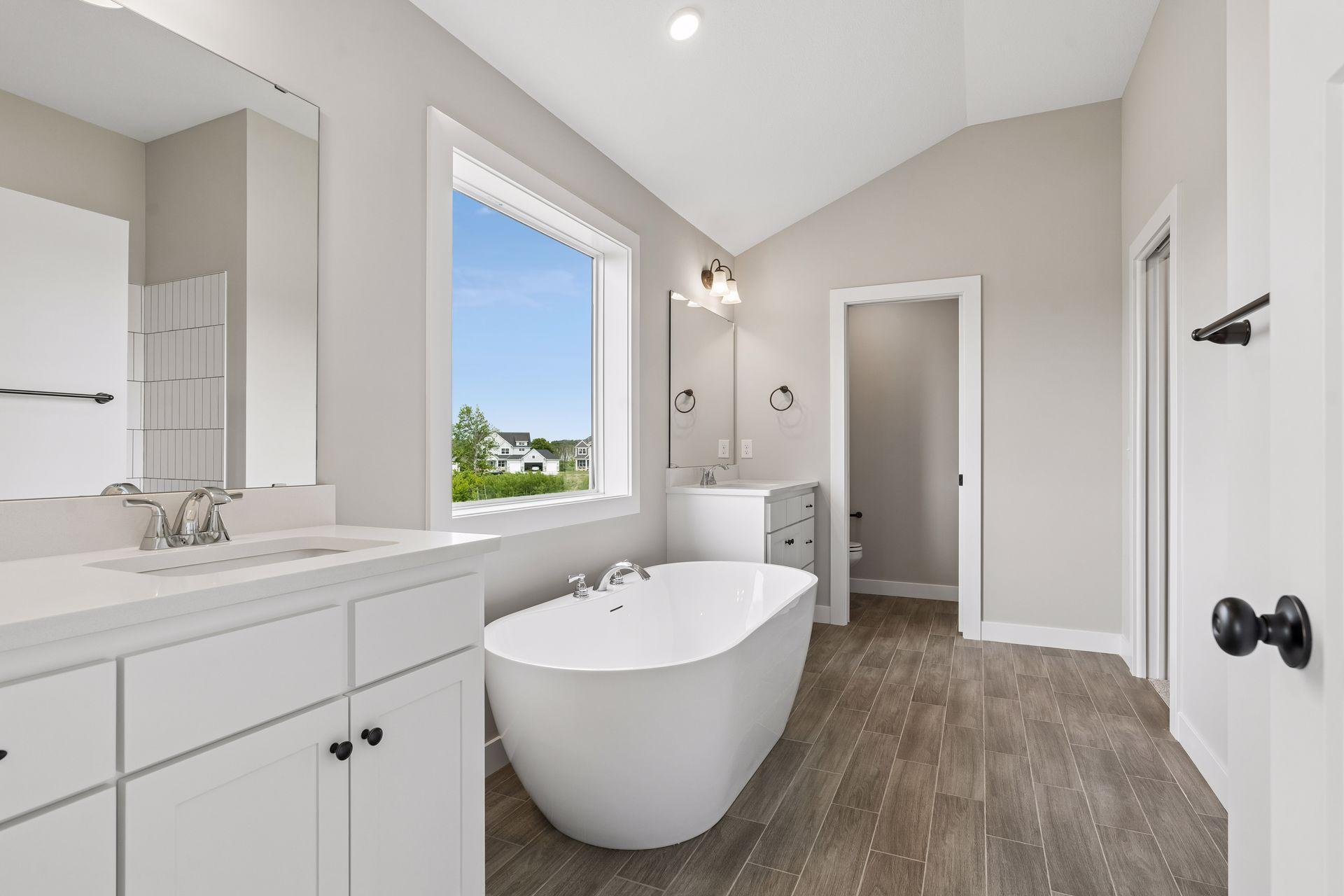 The luxurious, private bath comes with a freestanding tub.