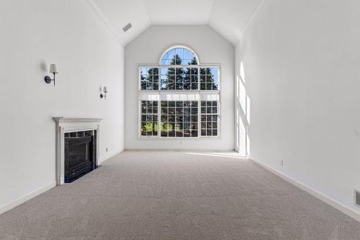 Living Room retreat with gas fireplace & 17ft ceiling