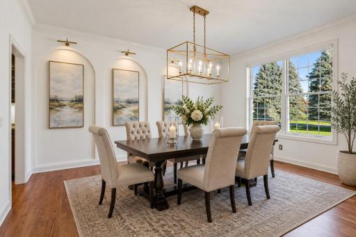 Elegant formal Dining Room with arched art niches. Virtually Staged Using AI
