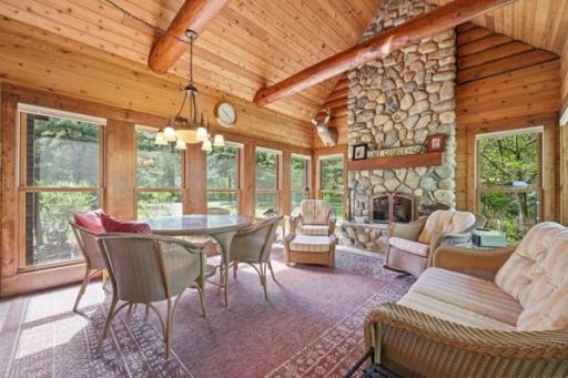 Sun room with stone fireplace