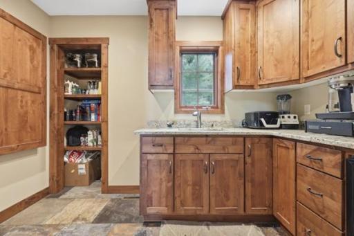 Walk in pantry complete with wine refrigerator