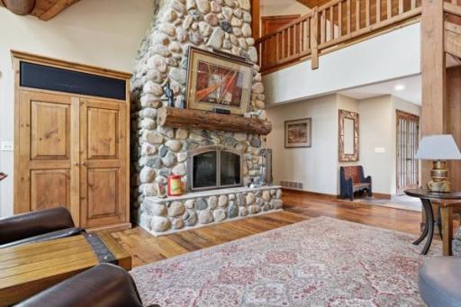Stone fireplace and reclaimed chestnut wood flooring