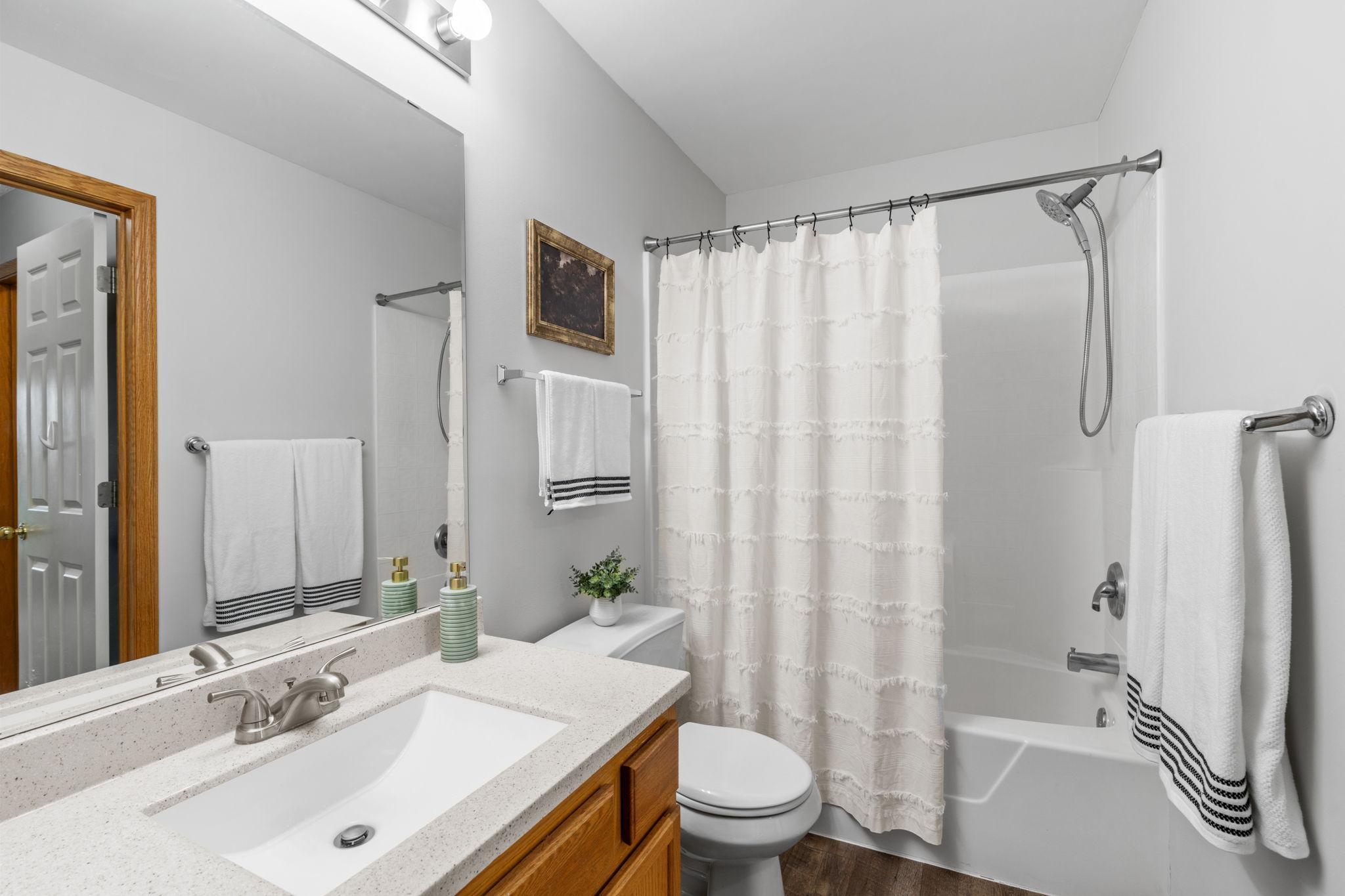 Full bath with extra storage cabinets next to the sink (not in pic)