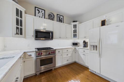Neutral woodwork and gorgeous marble counter will make food prep a joy!