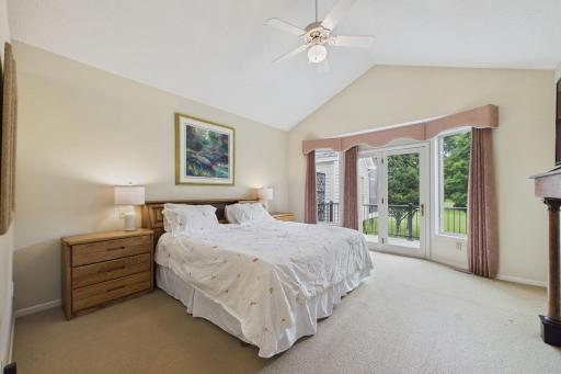 Primary Bedroom on the Main Floor boasts a deck for you to welcome the morning.