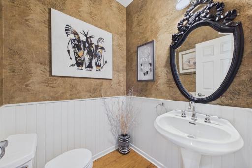 Charming powder room just off the foyer.