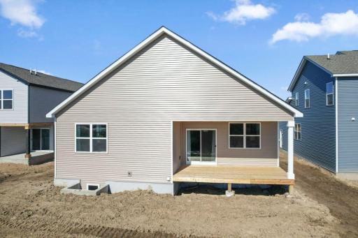 This is a previously built home. 1712 Oak Creek Drive will be similar with a covered deck and lower level egress window.