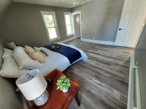 Another view of the primary bedroom. That's a walk-in closet in the corner.