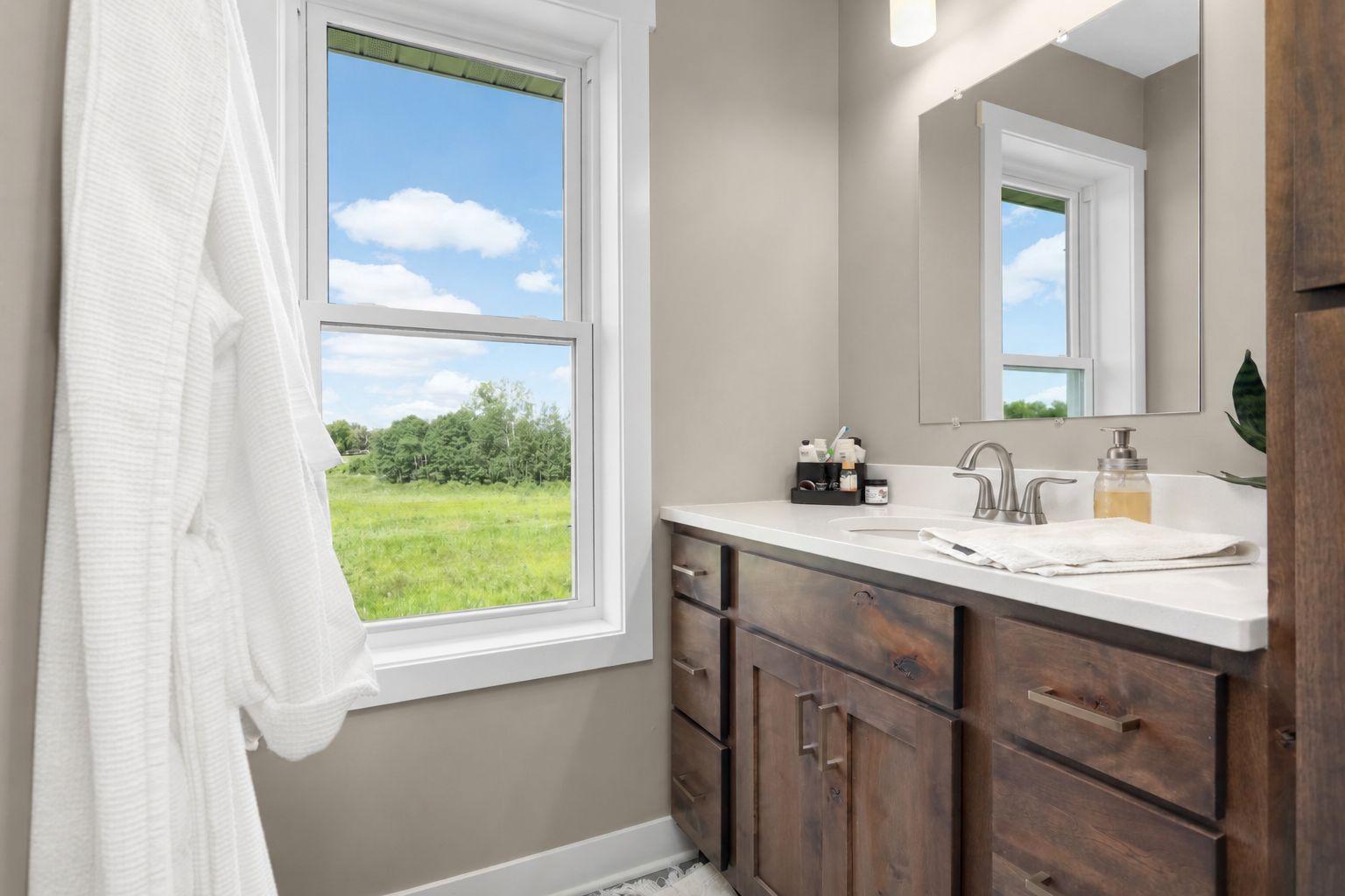 Private primary bathroom features a double vanity and modern finishes