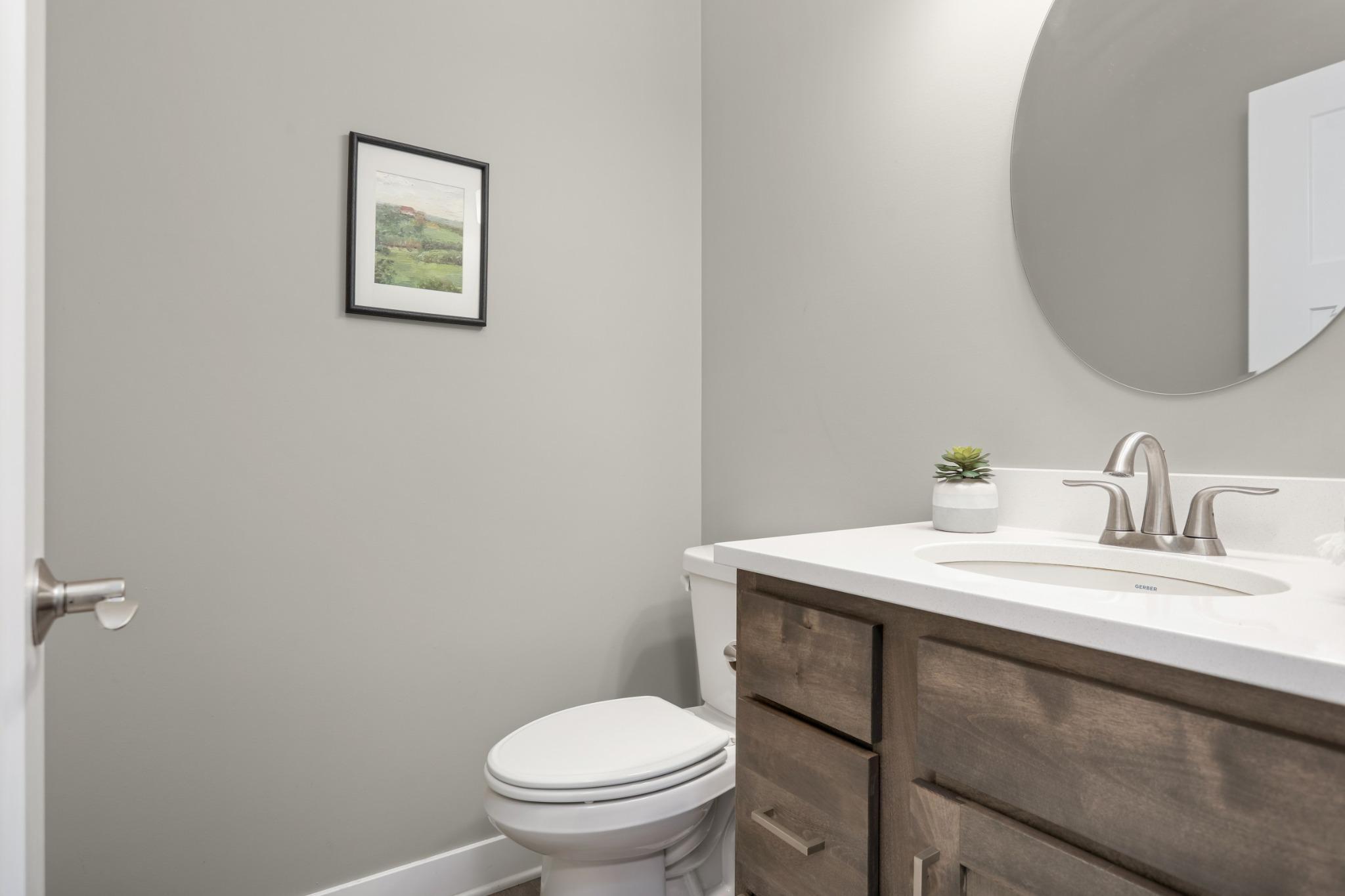 Convenient Main-Level Half Bathroom off the Mudroom