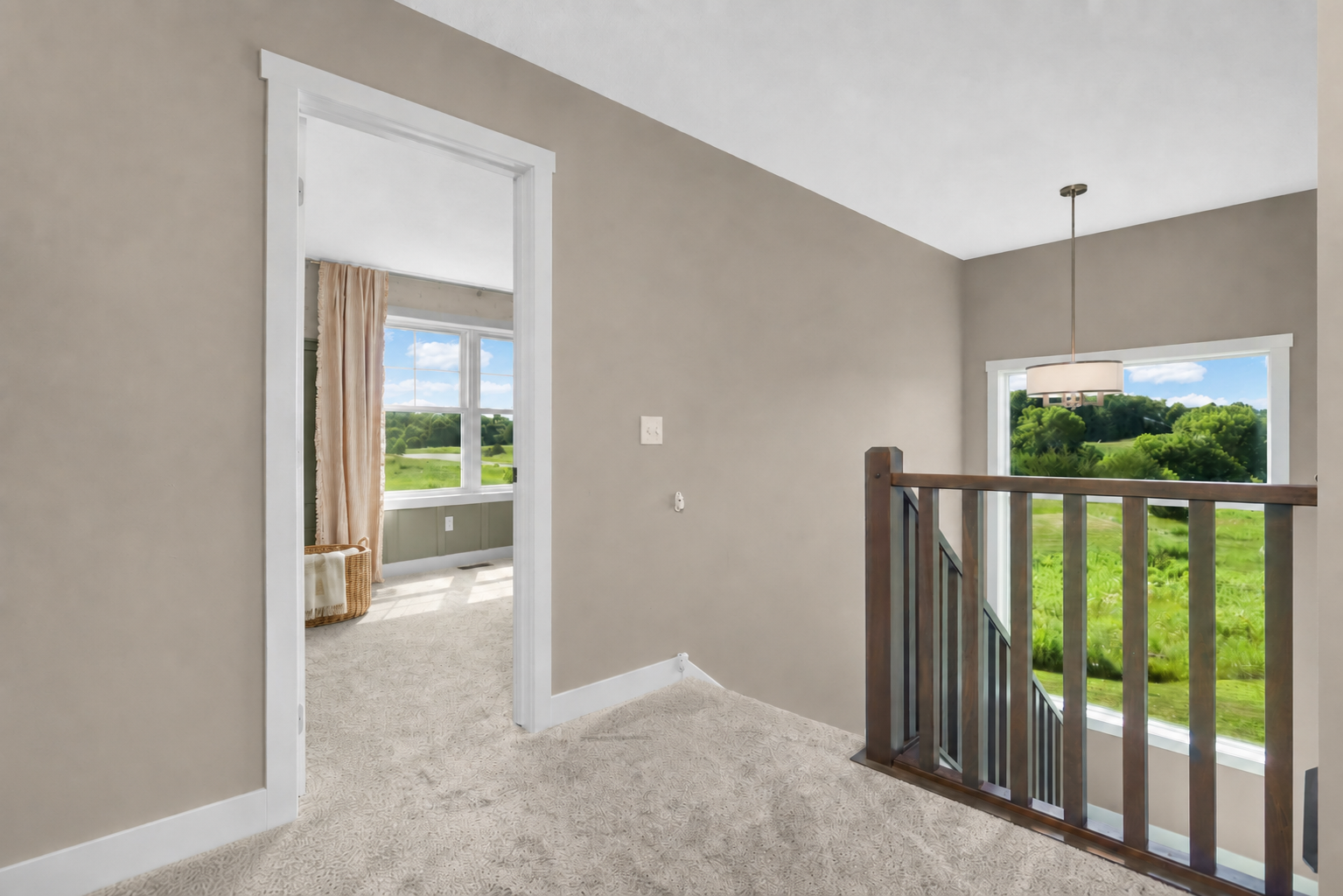 Large windows showcase the surrounding scenery and beautiful sunset views