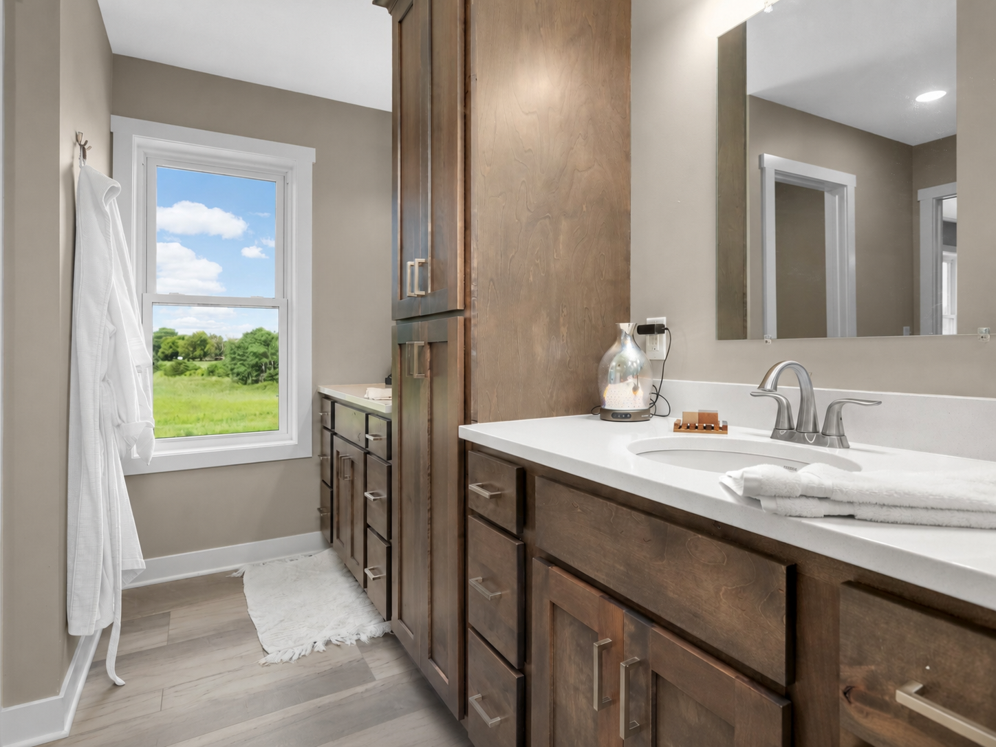 Private primary bathroom features a double vanity and modern finishes