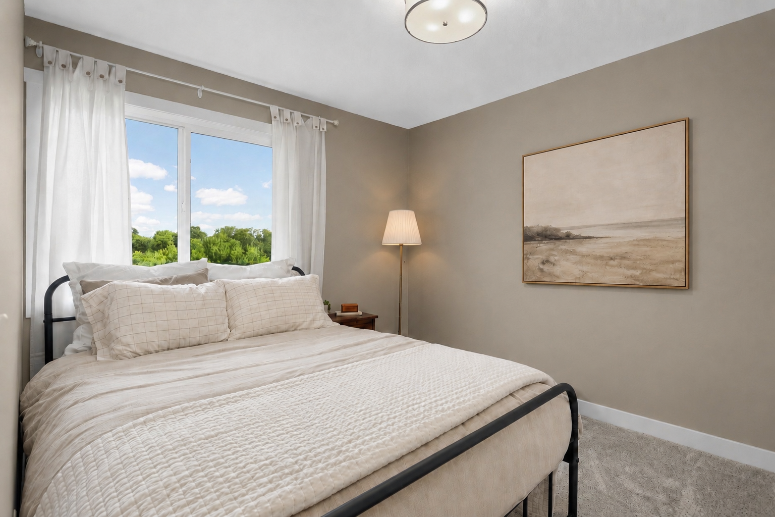 Comfortable additional fourth bedroom with ample natural light and closet storage