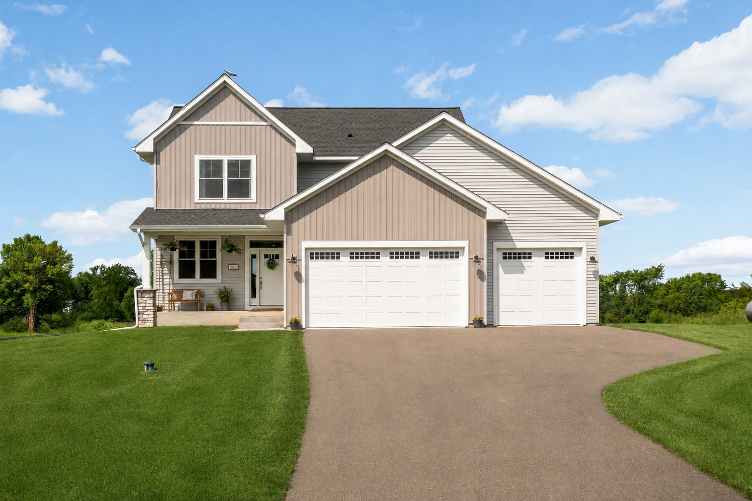 Welcoming front exterior with attractive stone accents and a covered entry
