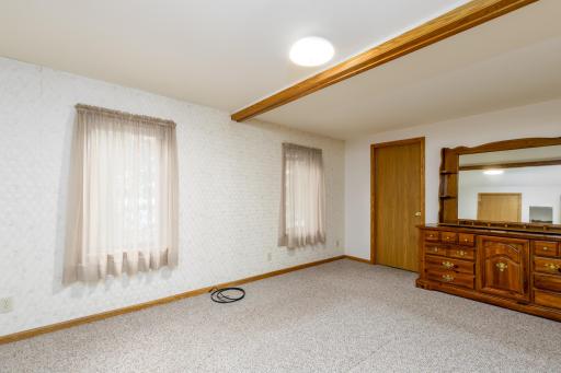 Primary bedroom on upper level with walk-in closet.