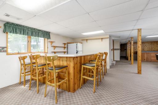 Large corner Knotty-pine bar with vintage bar stools from 1029 Bar in NE Mpls which can be included.