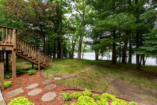 Great landscaping and stepping stone path to the lake.