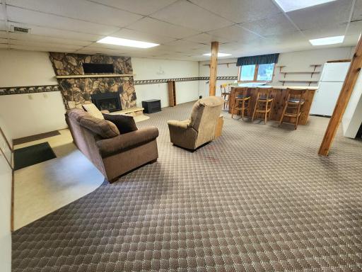 There is a walk-behind bar adjacent to the family room and a bonus area great for office or game area.
