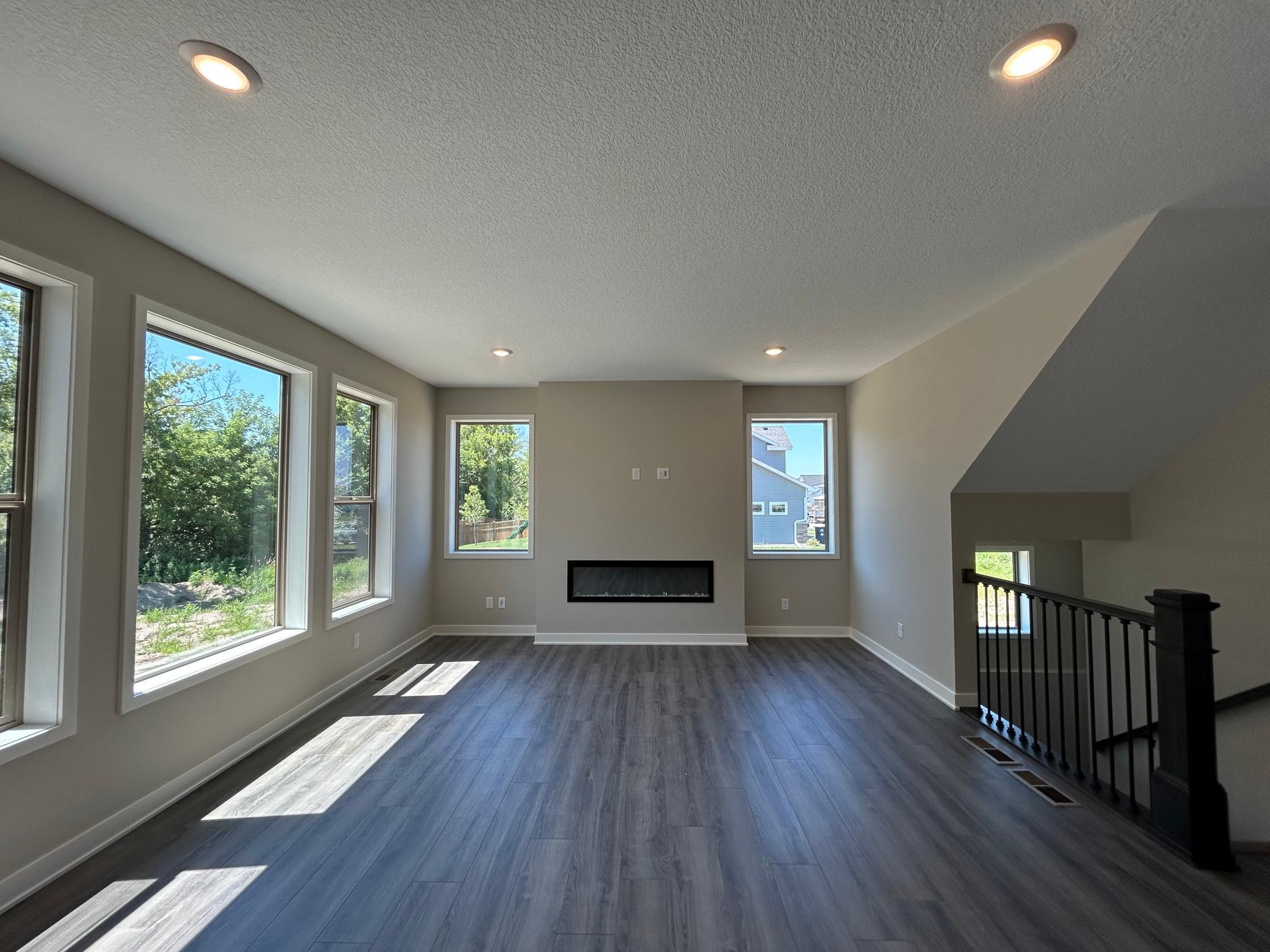 Main level recreation room with electric fireplace