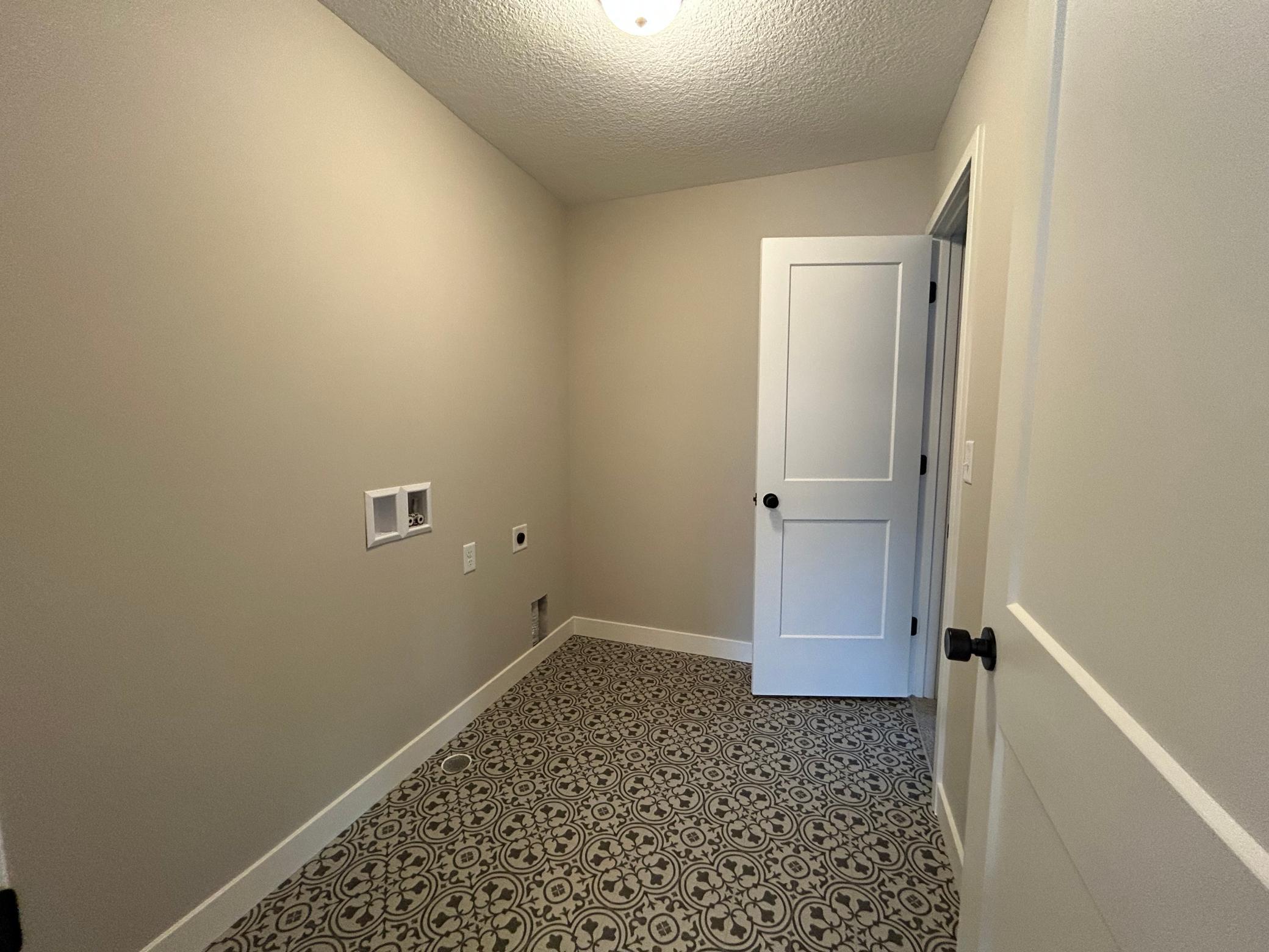 Laundry room conveniently located off of the primary bath