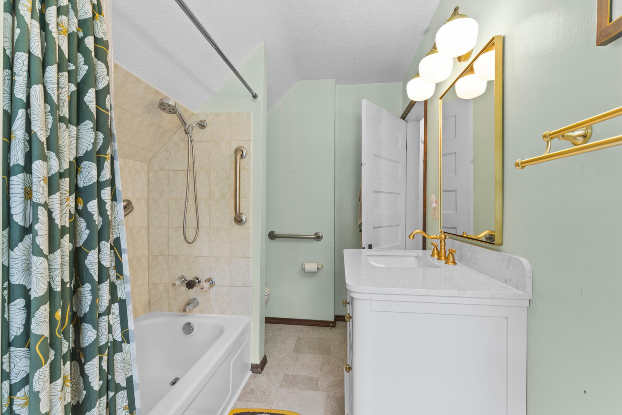 Spacious upper level bath with new vanity.