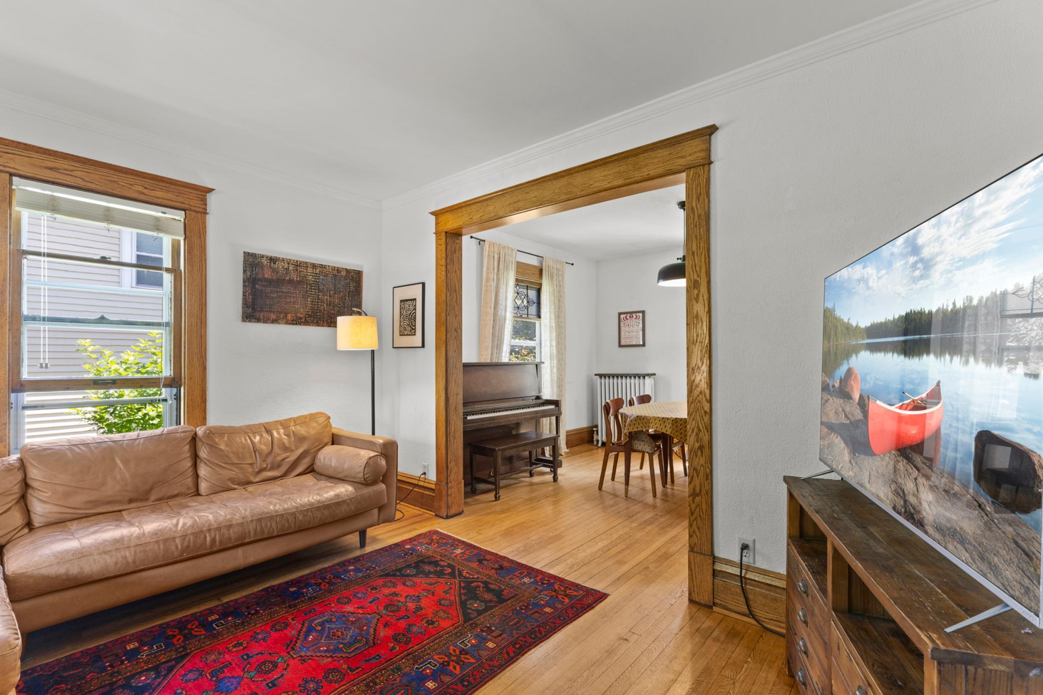 Main level has beautiful woodwork & hardwood floors.