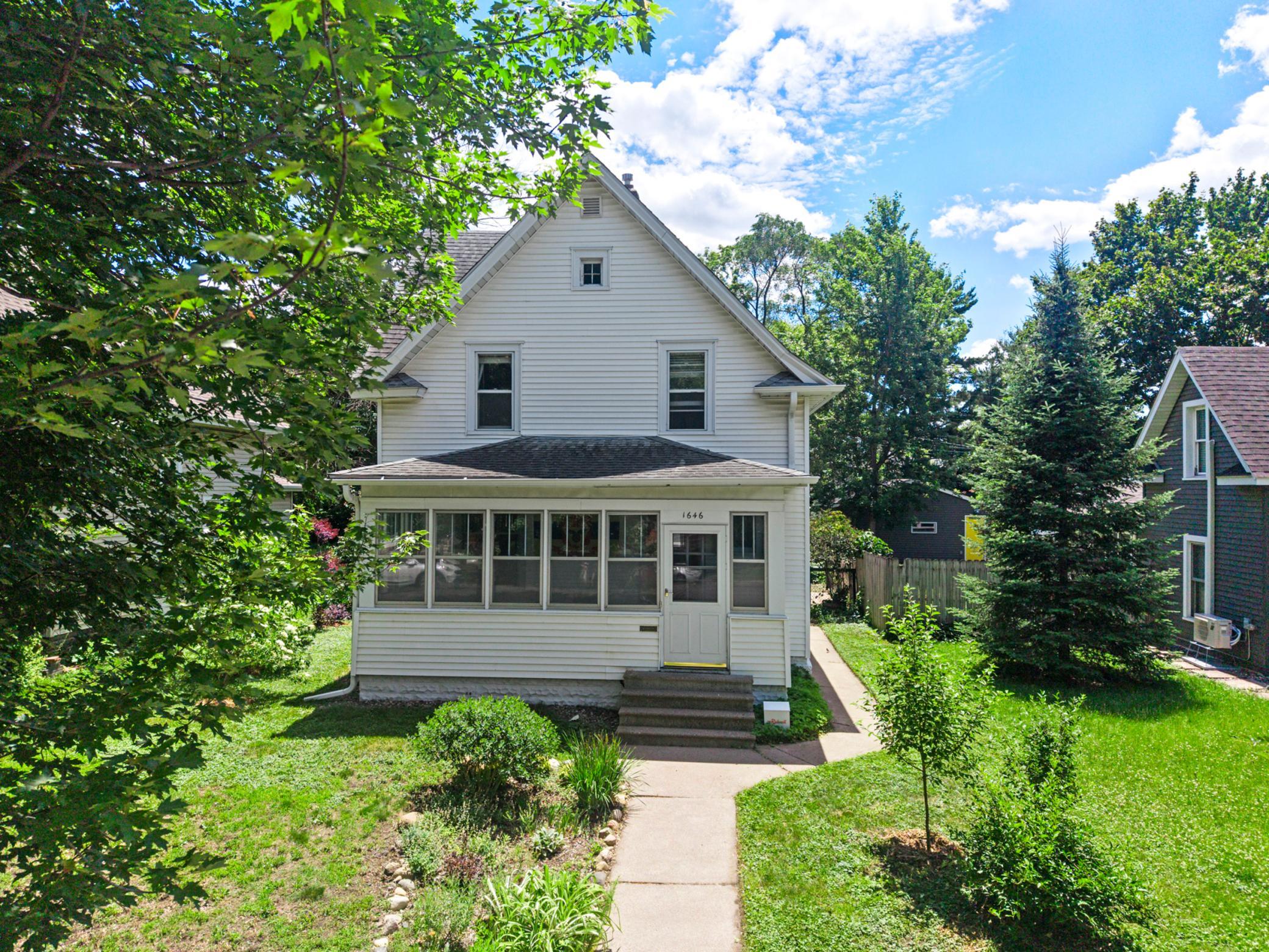 Wonderful trees & perennials surround this home.