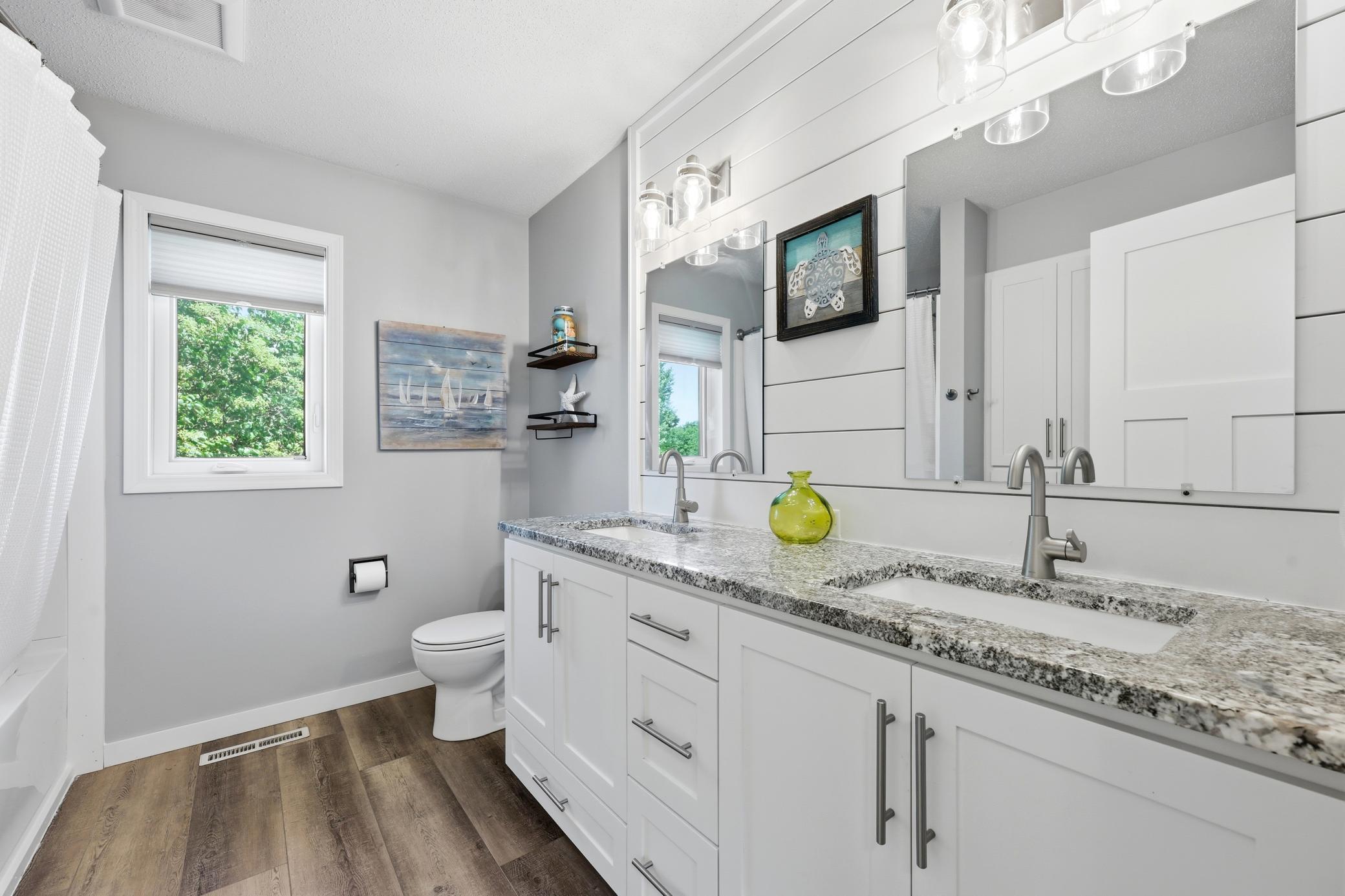 Upper level guest bath - dual sinks - new tub